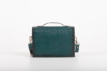 CLUTCH BAG WITH DECORATIVE METAL ACCESSORIES AND HANDLE IN DARK GREEN