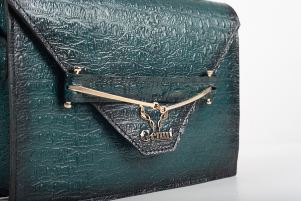 CLUTCH BAG WITH DECORATIVE METAL ACCESSORIES AND HANDLE IN DARK GREEN