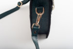 CLUTCH BAG WITH DECORATIVE METAL ACCESSORIES AND HANDLE IN DARK GREEN