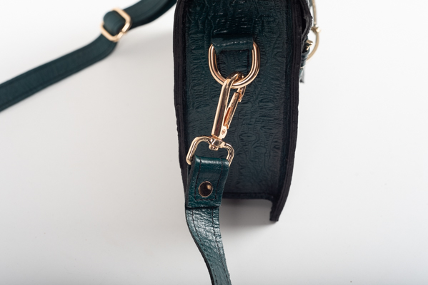 CLUTCH BAG WITH DECORATIVE METAL ACCESSORIES AND HANDLE IN DARK GREEN