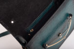 CLUTCH BAG WITH DECORATIVE METAL ACCESSORIES AND HANDLE IN DARK GREEN