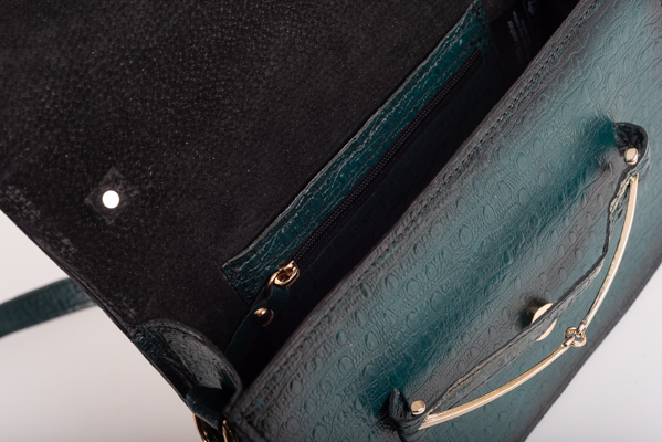 CLUTCH BAG WITH DECORATIVE METAL ACCESSORIES AND HANDLE IN DARK GREEN